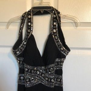 This is a black and silver fitted dress. It was worn to prom once. (long)